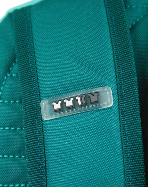 Minecraft Diamond backpack in turquoise and grey with pixel face design and front Minecraft patch.