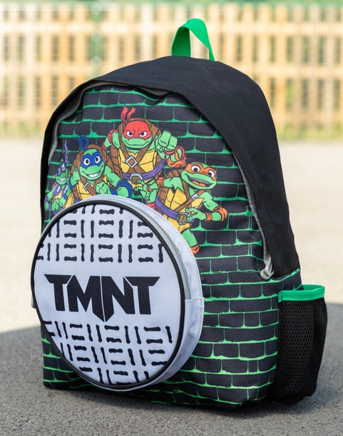 Kids Teenage Mutant Ninja Turtles backpack featuring Leonardo, Donatello, Raphael and Michelangelo with TMNT manhole cover front pocket